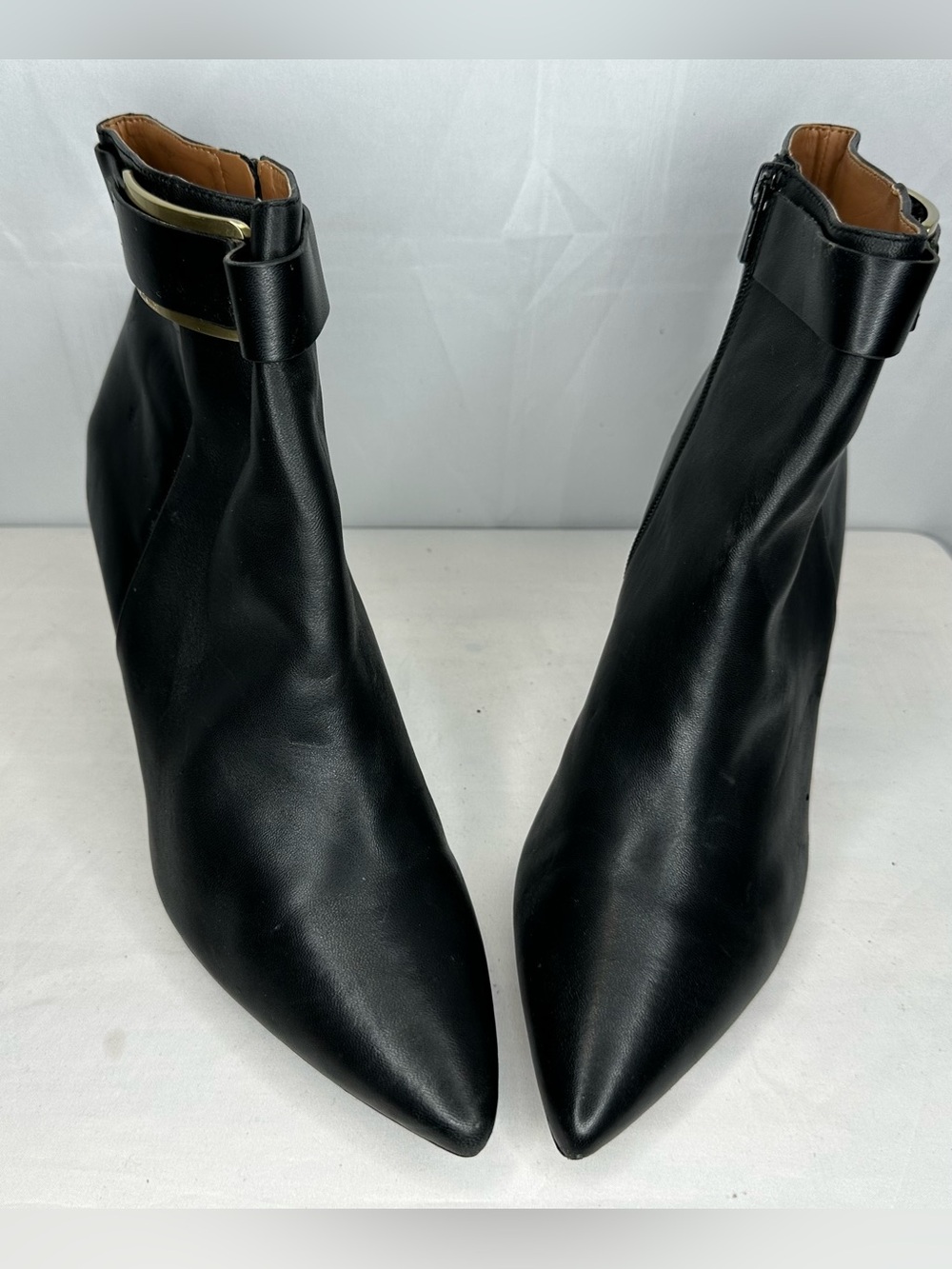 Calvin Klein Black Pointed Toe Ankle Booties with Gold Accent